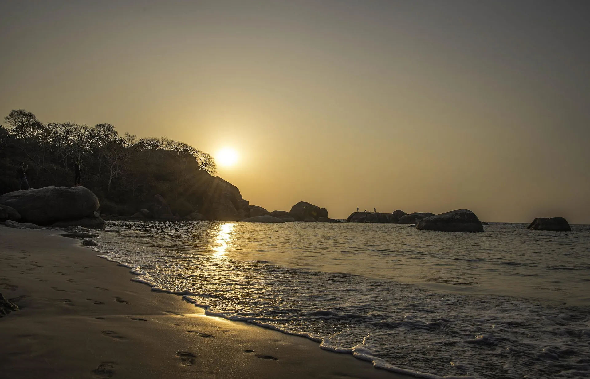 Sunset over the rocks at Agonda beach, South Goa