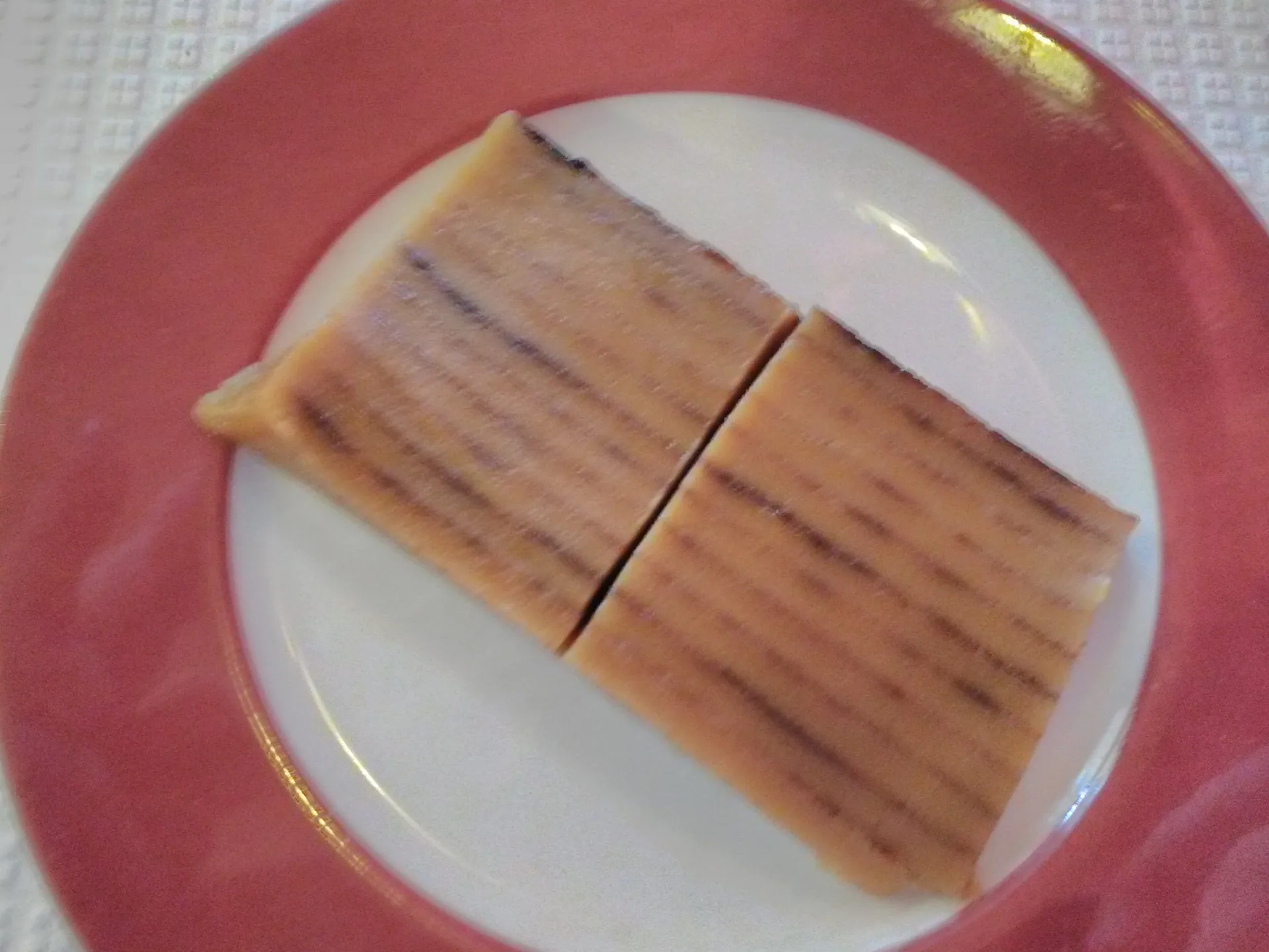 Slices of bebinca, Goa's layered coconut and egg dessert, on a plate
