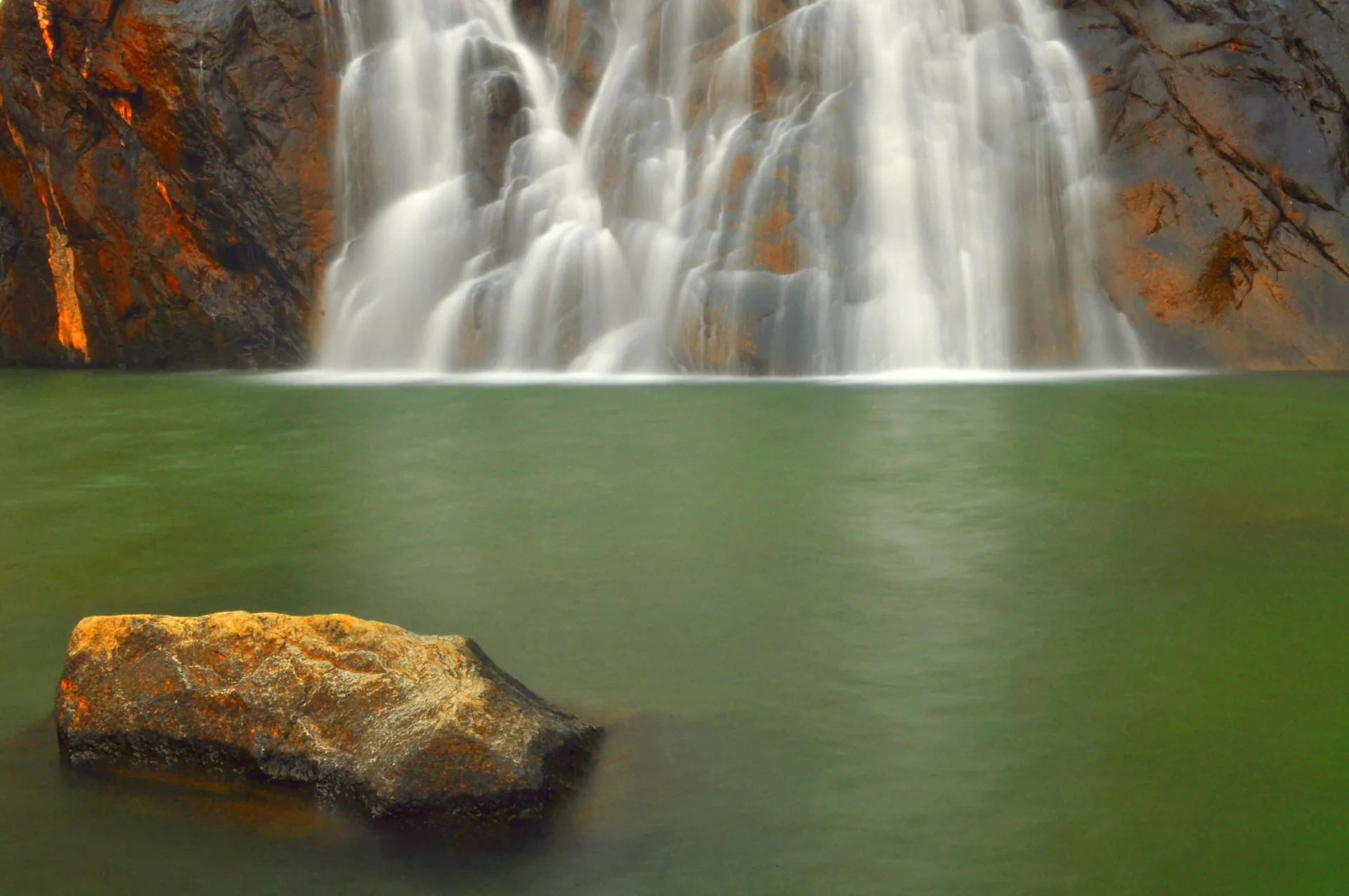 Dudhsagar Falls pouring into its green pool in the Western Ghats